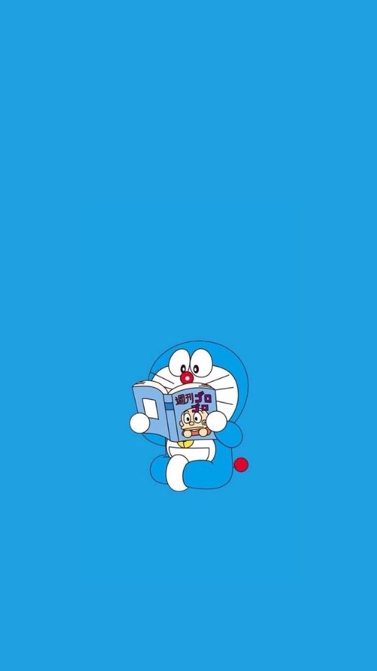 Hình nền Doraemon đang đọc truyện tranh 